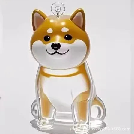 Transparent pet memorial keychain capsule, clear dog figure with tan hood and smiling face