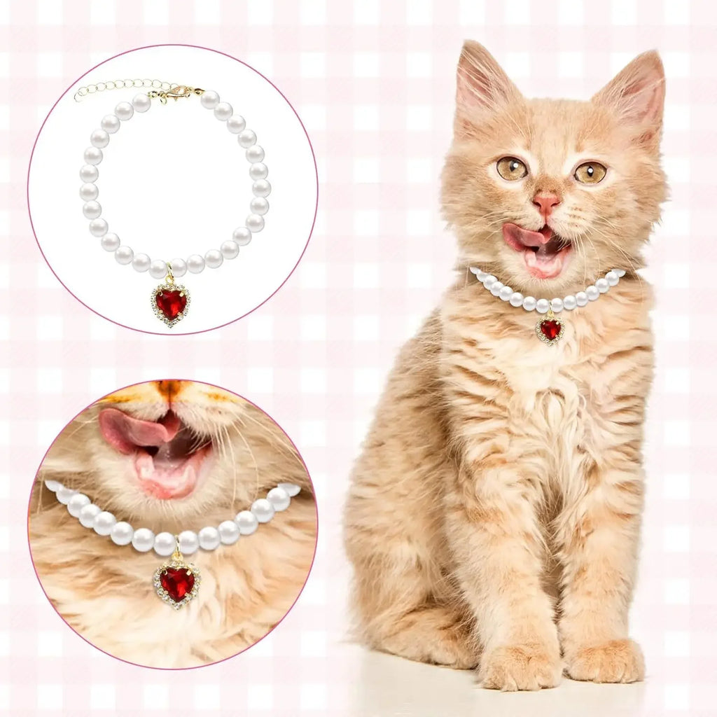 Pet pearl necklace collar with white bead strand and red heart pendant charm.