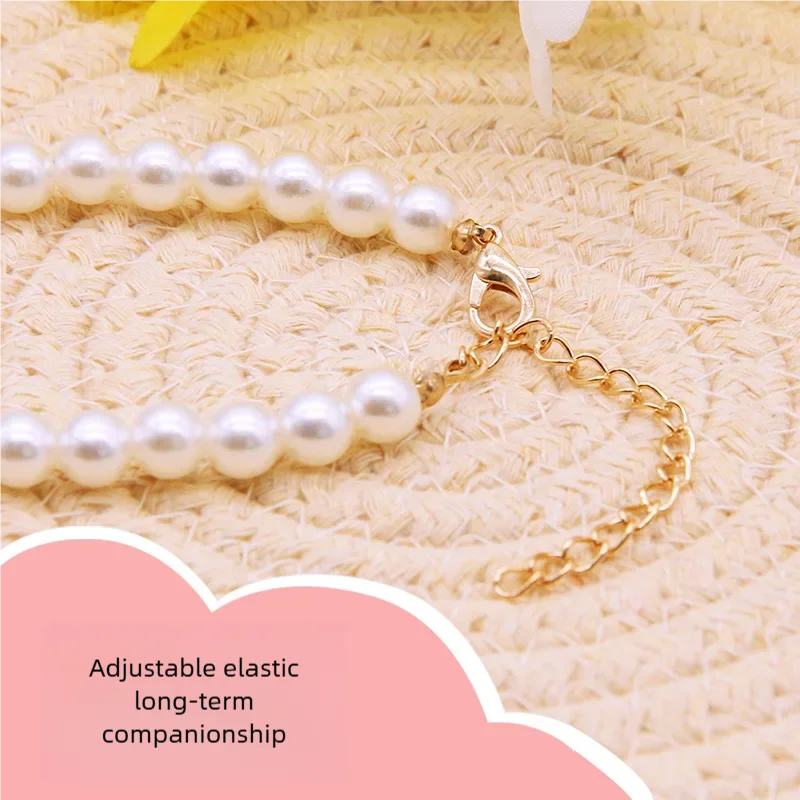 Adjustable pearl pet collar with gold chain adjuster and heart charm