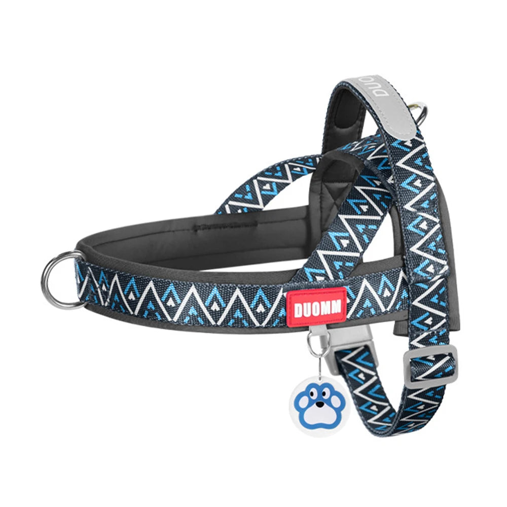 Black no-pull padded dog harness vest with blue geometric pattern and D-ring hardware.