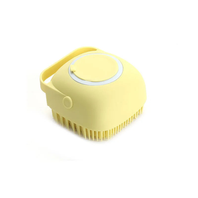 Yellow pet bathing brush with soft silicone massage bristles and round lid