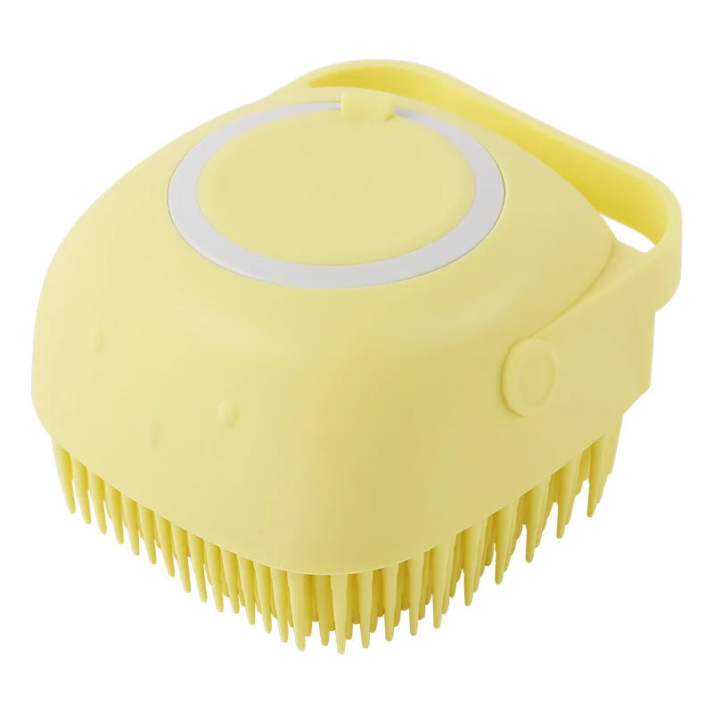 Yellow pet bath silicone massage brush close-up with oval lid and soft bristle teeth