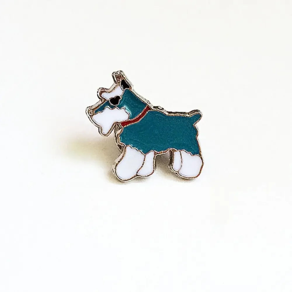 Enamel pin of teal-and-white cartoon dog with red collar