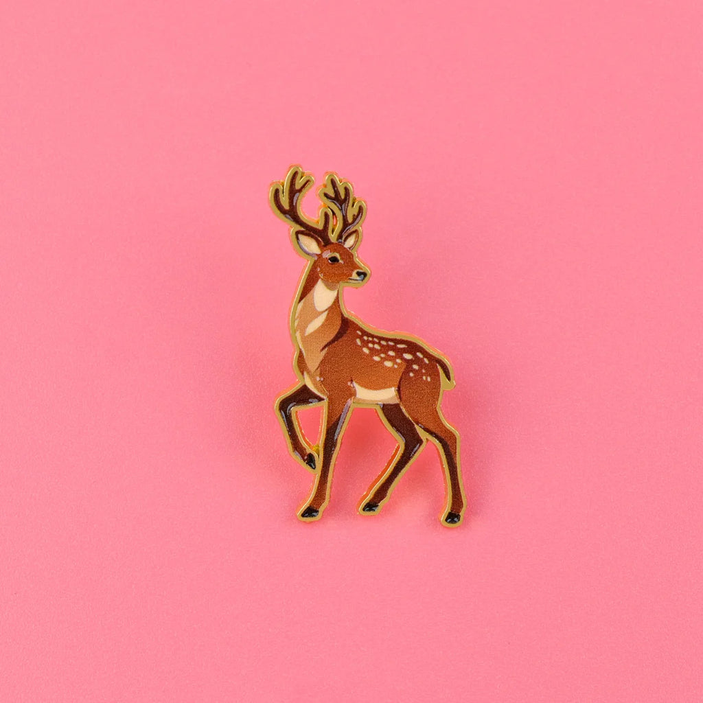 Brown deer enamel pin with antlers and white speckled dots