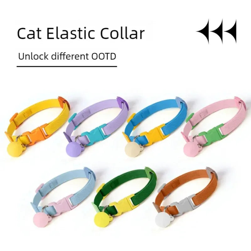Elastic cat collars in multiple colors, each with a round bell charm